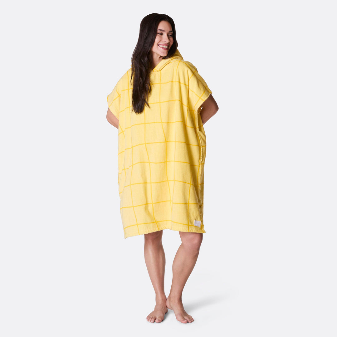 Keltainen kylpyponcho