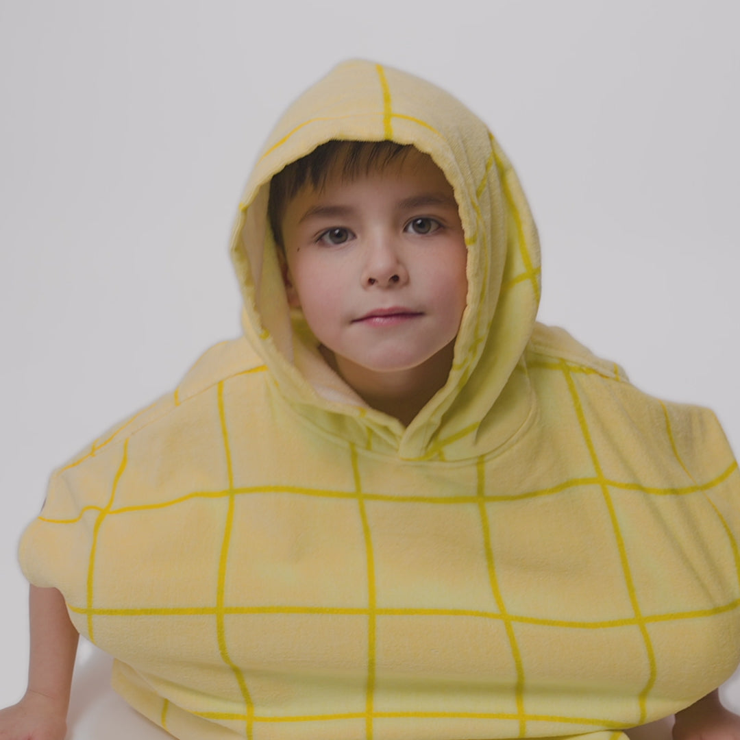 Lasten keltainen kylpyponcho